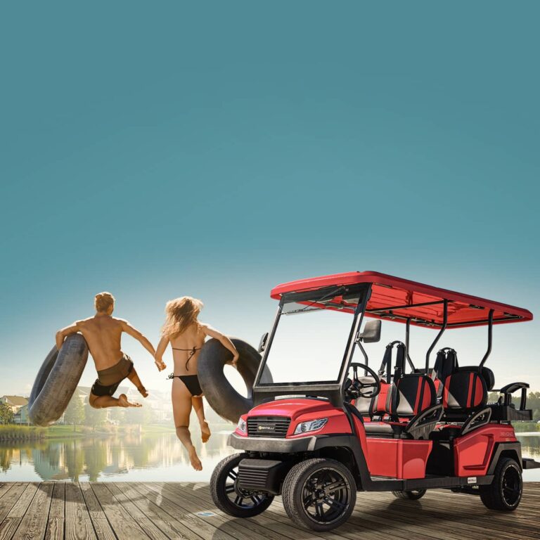 A man and a woman holding hands while standing next to a bintelli beyond street-legal 4PR red golf cart