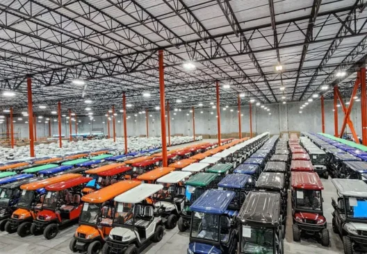 Overhead shot ofBintelli Golf Cart Warehouse with Bintelli Beyond Lifted 4PR street legal golf cart and Bintelli Beyond 4PR street legal golf cart fleet in Ocean Blue, Black, Burgundy, Hydro, Mint, Navy, Red, Titanium and White