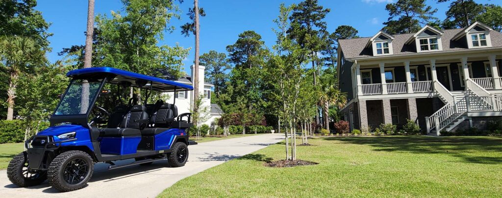 bintelli golf cart in a driveway